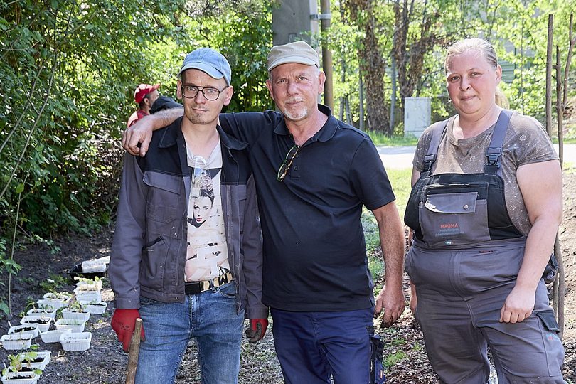 A three people standing 1