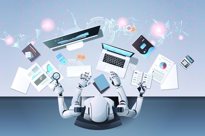 Adobe Stock 255861089 robot working at computer