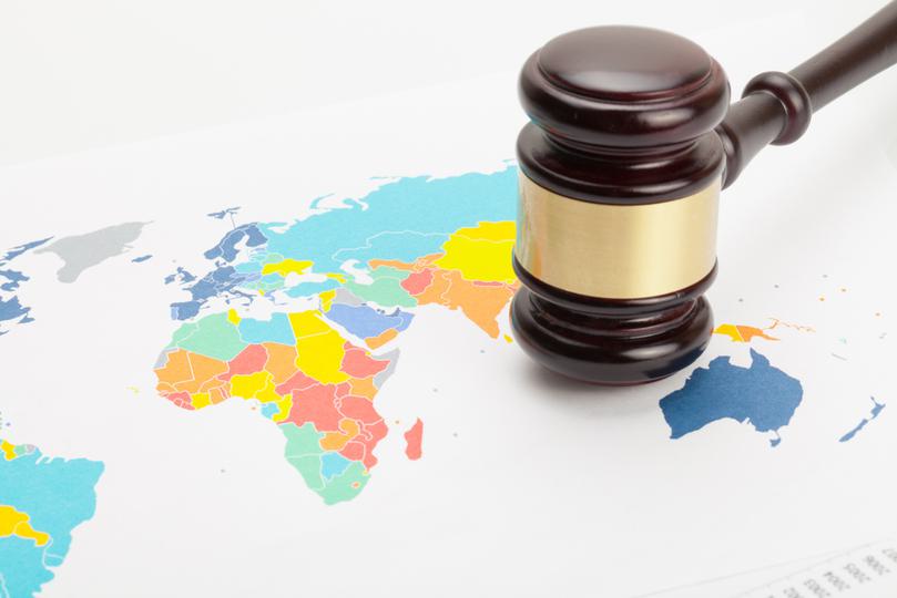 Gavel on top of world map