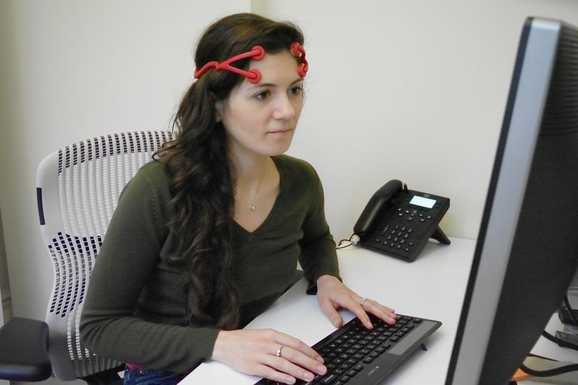 Lead author Hannah Maslen wearing a t DCS device
