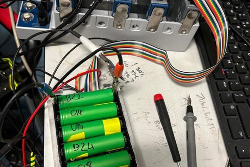 The actual setup of multi-channel, multi-frequency electrical excitation response (MMER). Photo showing eight battery cells in a testing device