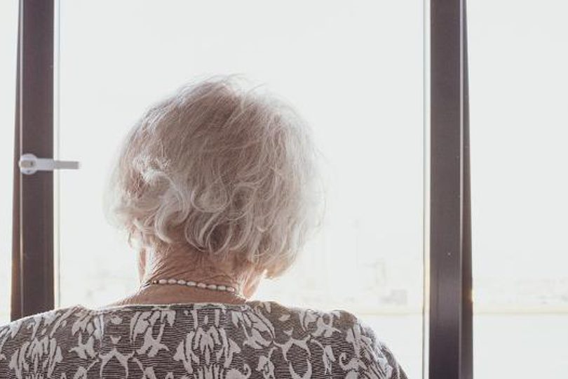Woman in window banner sm