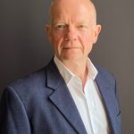 William Hague Headshot No Tie Dark Background
